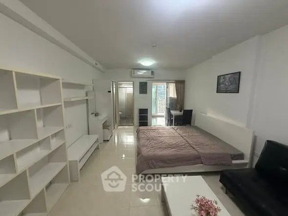 Spacious studio apartment with modern furnishings and natural light