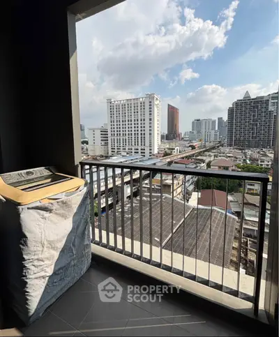 Urban balcony with city skyline view, perfect for enjoying the vibrant cityscape.