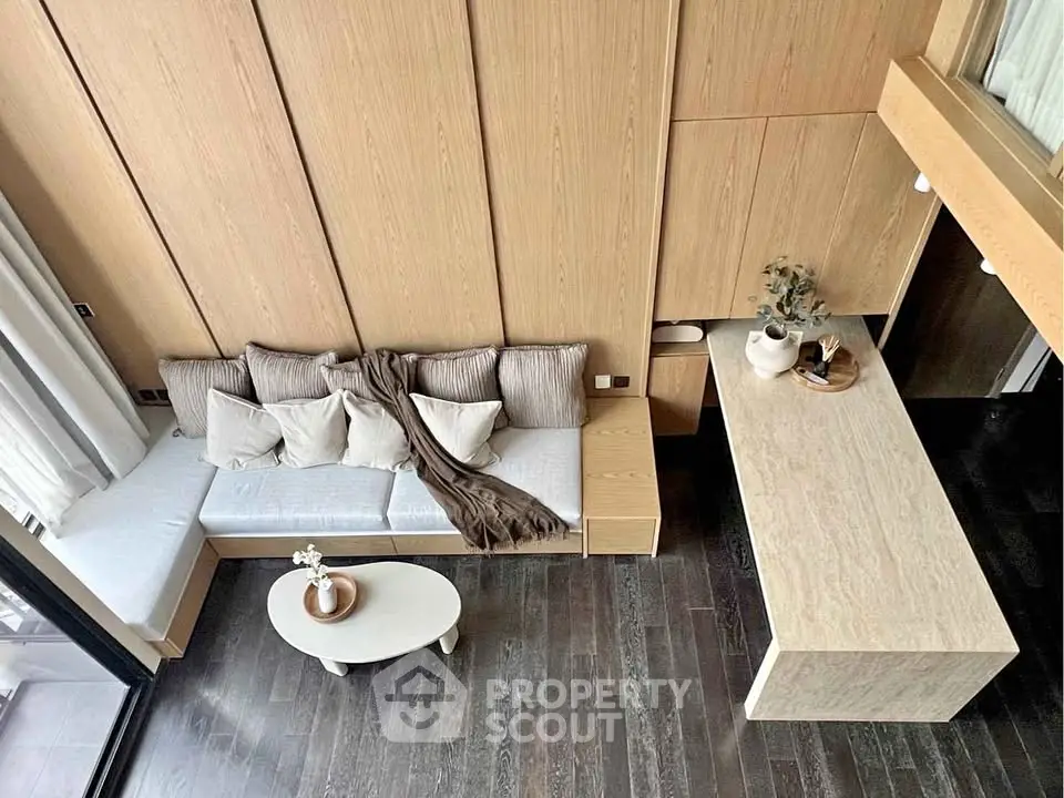 Modern living room with wooden accents and cozy seating area