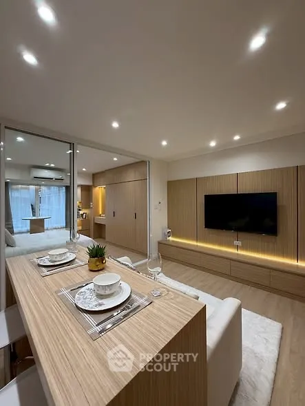 Modern living room with sleek wooden finishes and ambient lighting