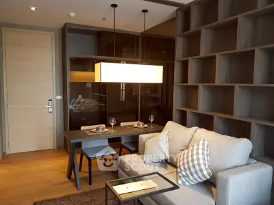 Modern living room with stylish dining area and cozy sofa in elegant apartment.