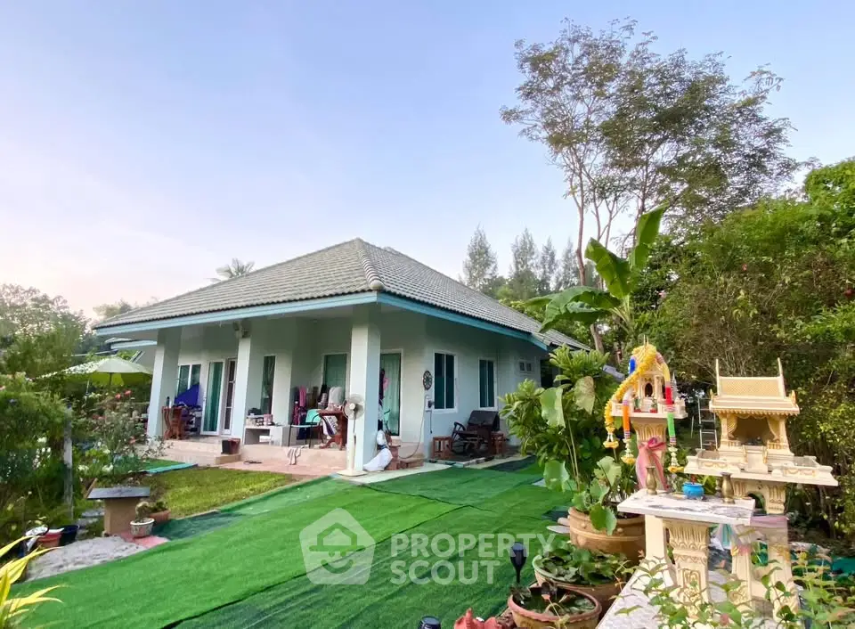 Charming single-story home with lush garden and traditional decor