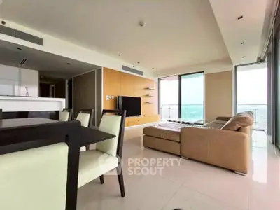 Spacious modern living room with panoramic views and elegant furnishings