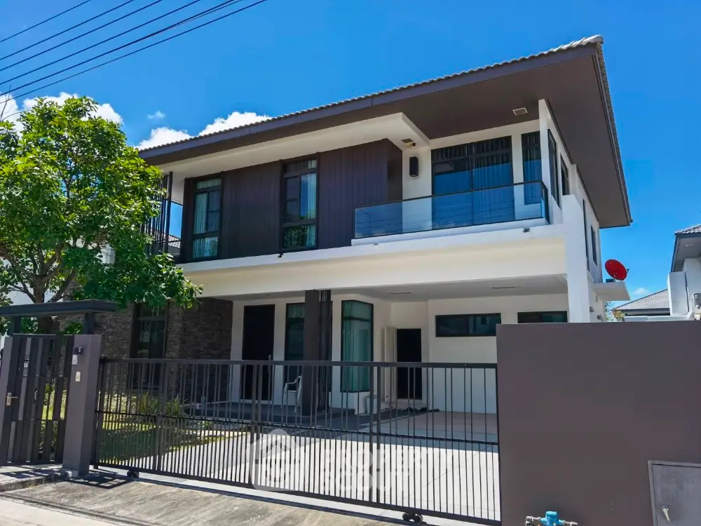 Modern two-story house with sleek design and spacious driveway