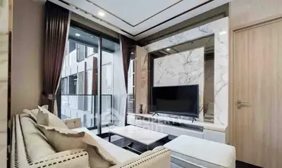 Luxurious living room with modern decor and balcony view