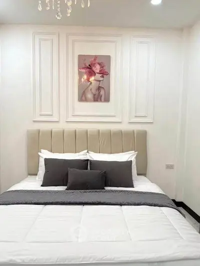 Elegant bedroom with stylish decor and plush bedding, perfect for relaxation and comfort.