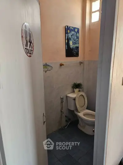 Cozy bathroom with artistic decor and natural light