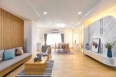 Spacious modern living room with elegant decor and ample natural light