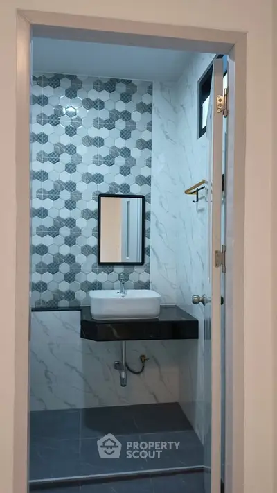 Modern bathroom with stylish tile design and sleek fixtures