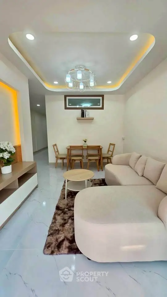 Modern living room with elegant lighting and cozy seating area