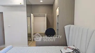 Modern bedroom with walk-in closet and stylish decor