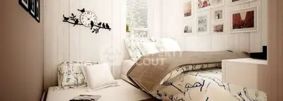 Cozy bedroom with stylish decor and natural light, perfect for relaxation.