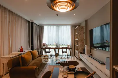 Stylish modern living room with elegant decor and large windows