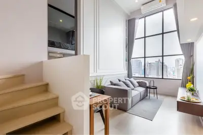 Modern living room with high ceilings and city view, featuring a cozy sofa and stylish decor.