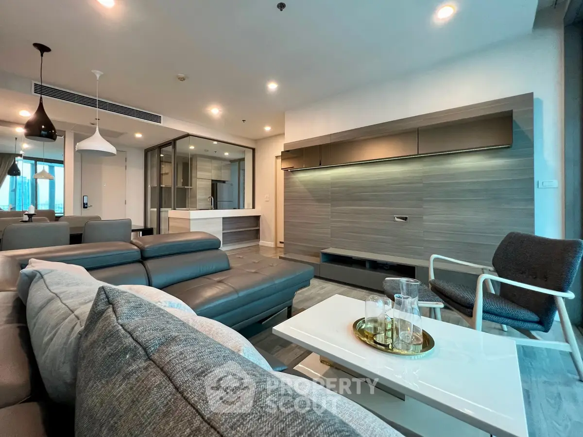Modern living room with sleek furniture and open layout in luxury apartment