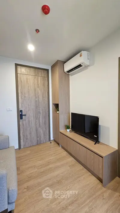 Modern living room with sleek furniture and air conditioning