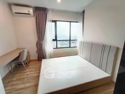 Modern bedroom with large window and stylish furniture in high-rise apartment