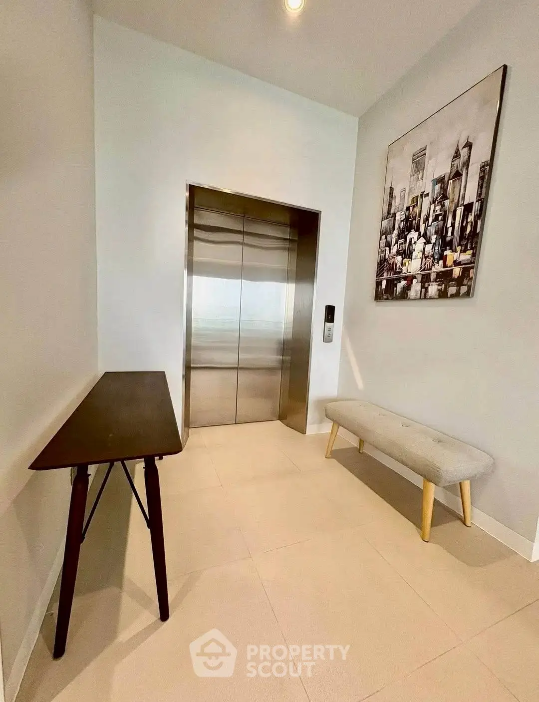 Modern elevator lobby with stylish decor and seating area
