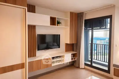 Modern living room with built-in TV unit and balcony view in stylish apartment.