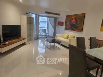 Spacious modern living room with sleek furniture and vibrant artwork, perfect for stylish urban living.