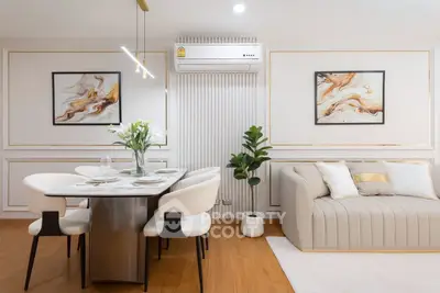 Elegant living room with modern dining area and stylish decor