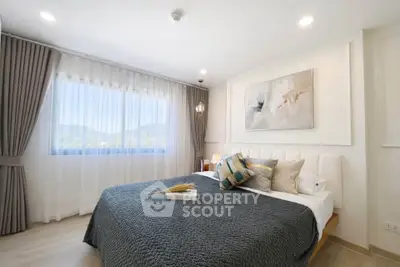 Luxurious bedroom with mountain view, elegant decor, and cozy bedding.