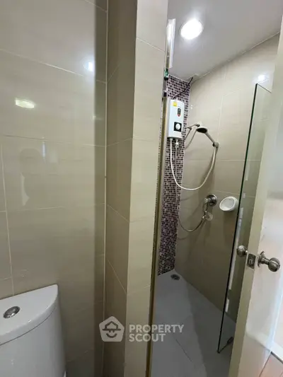 Modern bathroom with sleek shower and contemporary fixtures