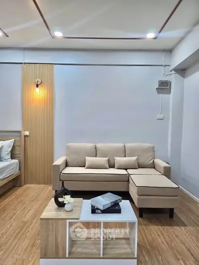 Modern living room with beige sofa and stylish decor