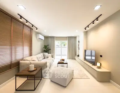Spacious modern living room with cozy seating and natural light