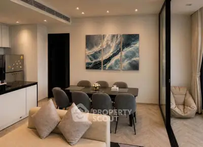 Modern open-plan living and dining area with stylish decor and natural light.