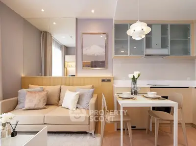 Modern living room with cozy beige sofa and elegant dining area in open layout.