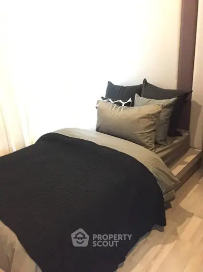 Cozy bedroom with modern decor and plush bedding