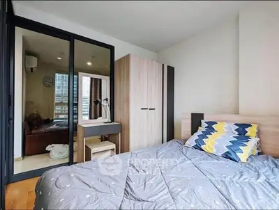 Modern bedroom with stylish decor and ample natural light