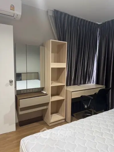 Modern bedroom with stylish furniture, featuring a comfortable bed, sleek desk, and ample storage space.