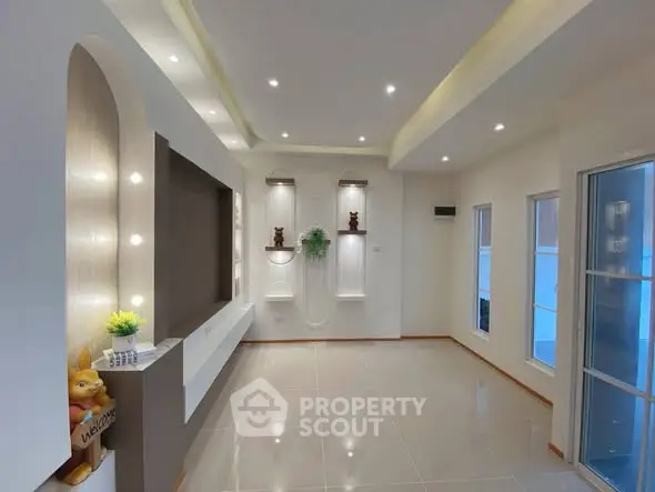 Modern living room with elegant lighting and decorative wall niches