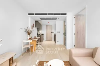 Modern open-plan living room with stylish decor and natural light