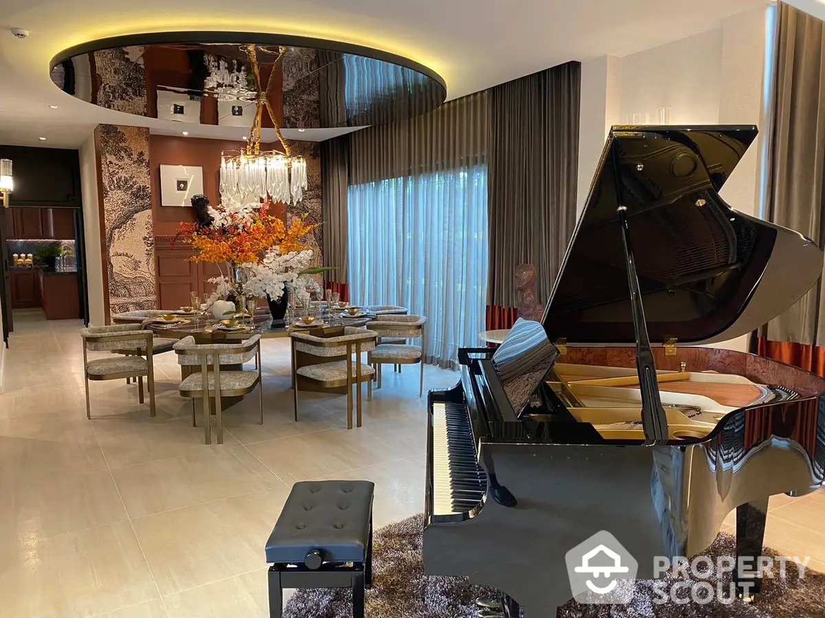 Luxurious spacious living room with grand piano, elegant dining area, modern lighting, and sophisticated decor.