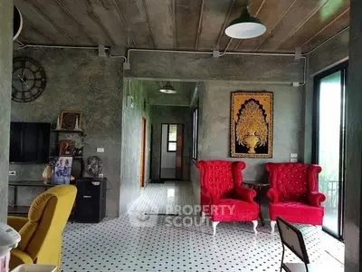 Stylish living room with vibrant red chairs and modern decor