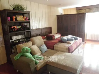 Cozy bedroom with plush toys and stylish furniture, perfect for a child's retreat.