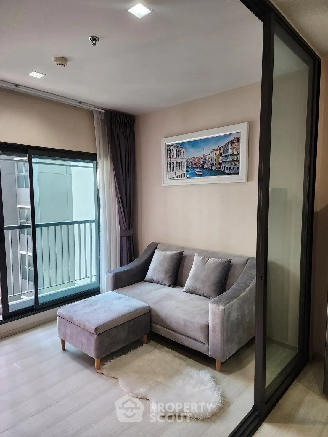 Modern living room with cozy sofa and balcony view