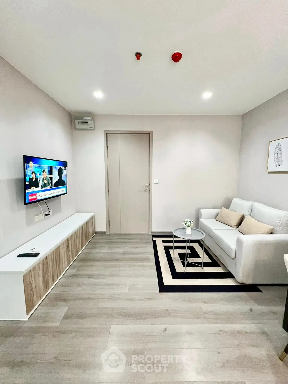 Modern living room with sleek design and cozy seating area