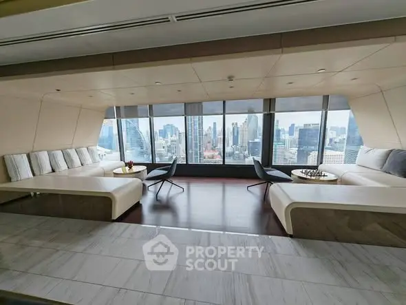 Luxurious penthouse living room with panoramic city skyline views and elegant modern furnishings.