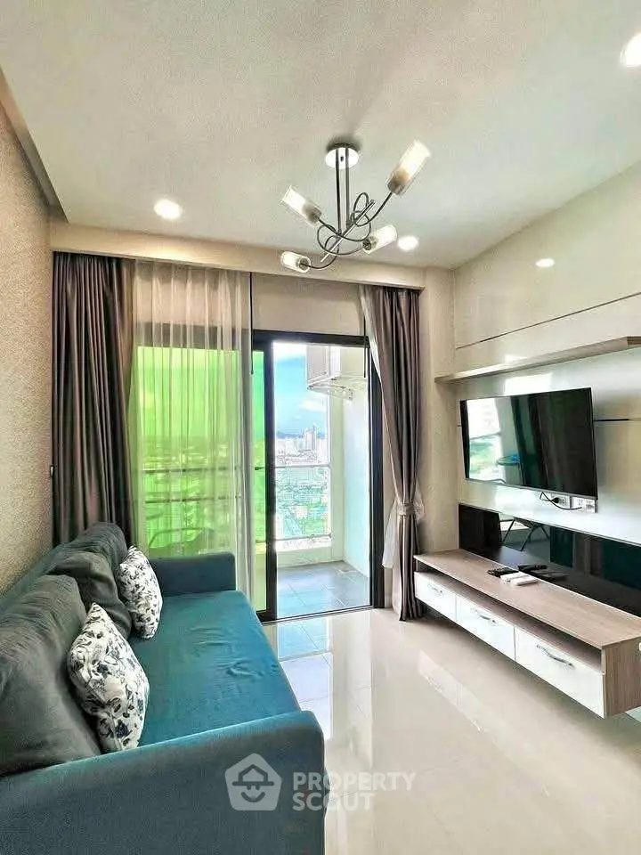 Modern living room with sleek design and balcony view in a stylish apartment.