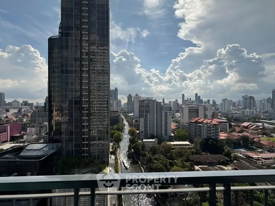 Stunning cityscape view from a high-rise balcony showcasing urban skyline and vibrant city life.
