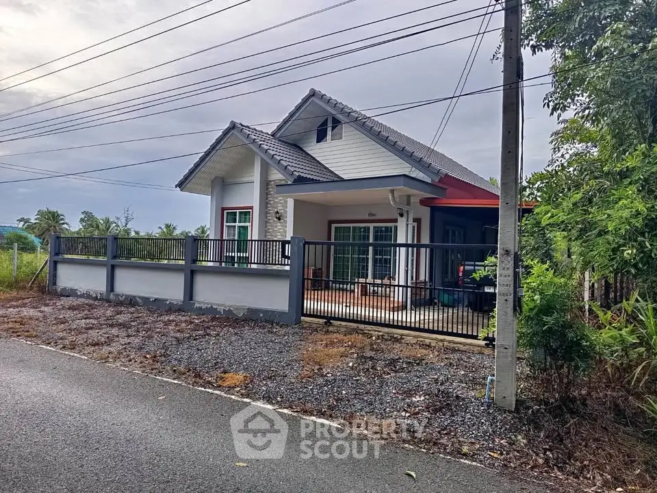 Charming single-story house with modern design and spacious yard in a serene neighborhood.