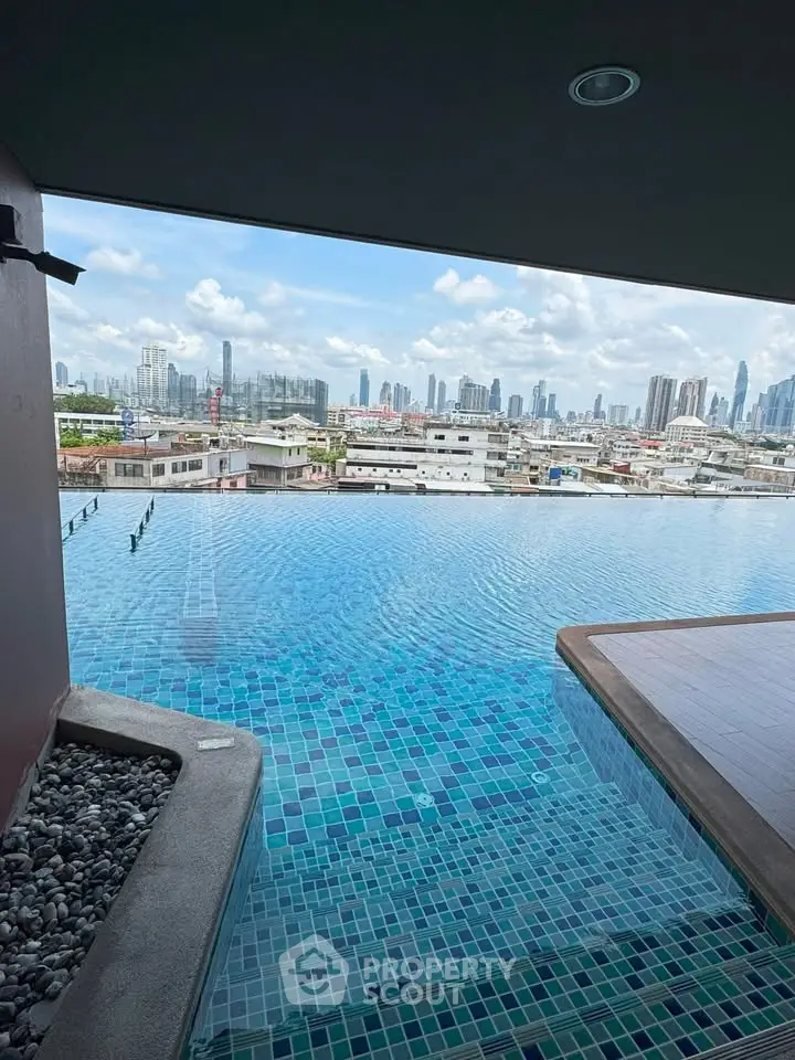 Stunning rooftop infinity pool with panoramic city skyline view