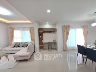 Spacious modern living room with elegant decor and natural light