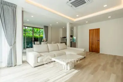 Spacious modern living room with elegant sofa and natural light