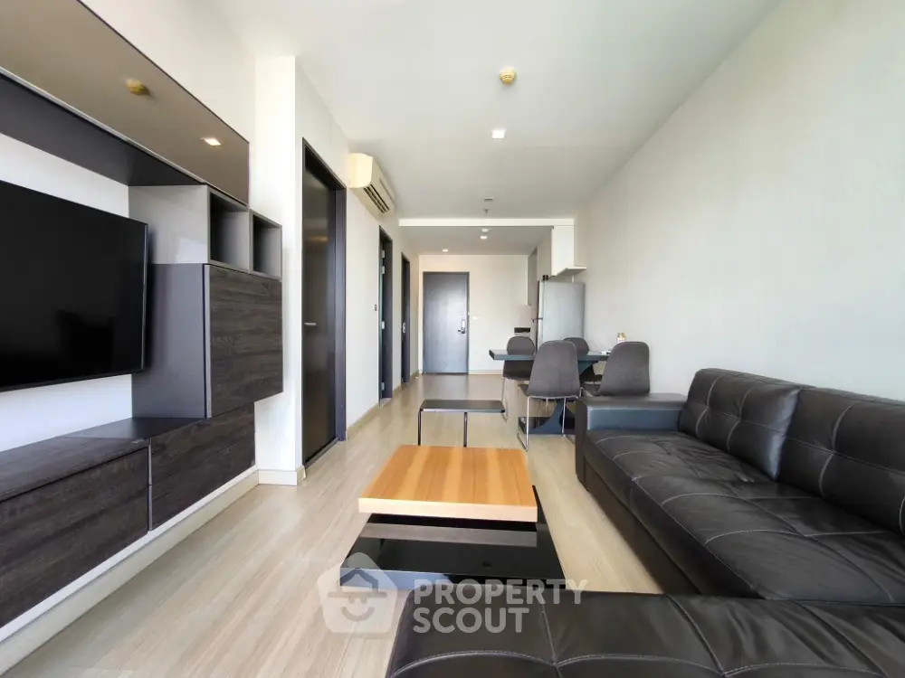 Modern living room with sleek furniture and open layout in a contemporary apartment.