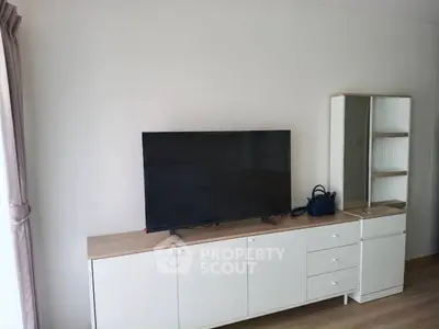 Modern living room with sleek TV stand and minimalist decor